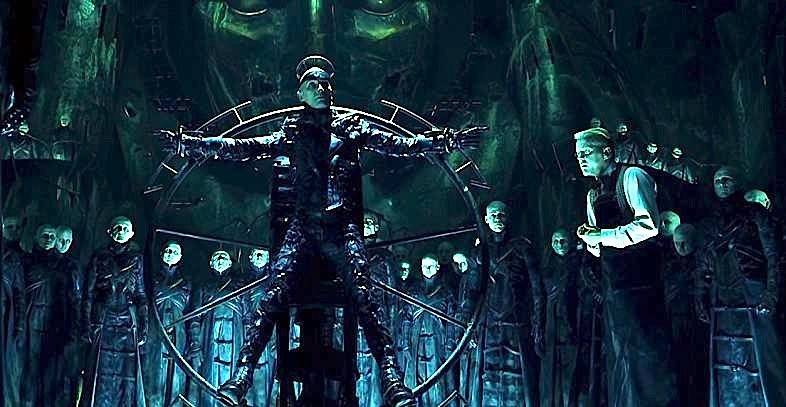 Dark City man tied to a wheel