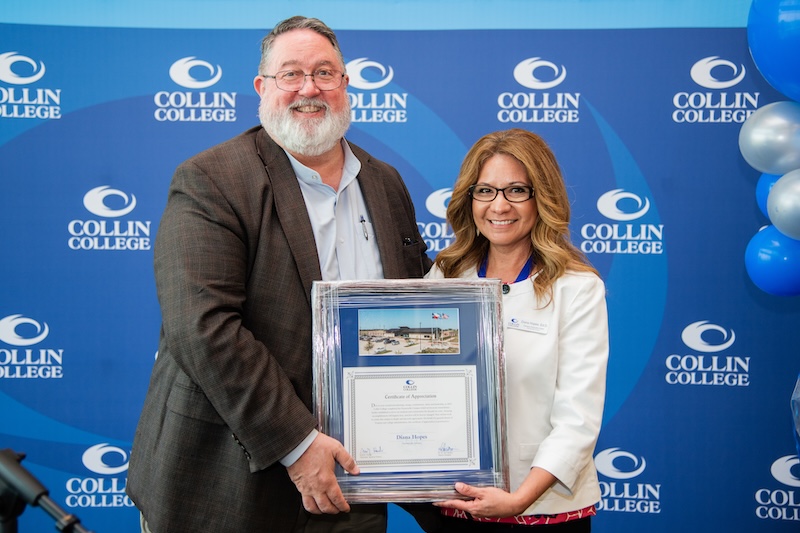 Collin College President Dr. Neil Matkin presents a certificate of recognition to Dr. Diana Hopes for her work at the Farmersville Campus. Collin College President Dr. Neil Matkin presents a certificate of recognition to Dr. Diana Hopes for her work at the Farmersville Campus.