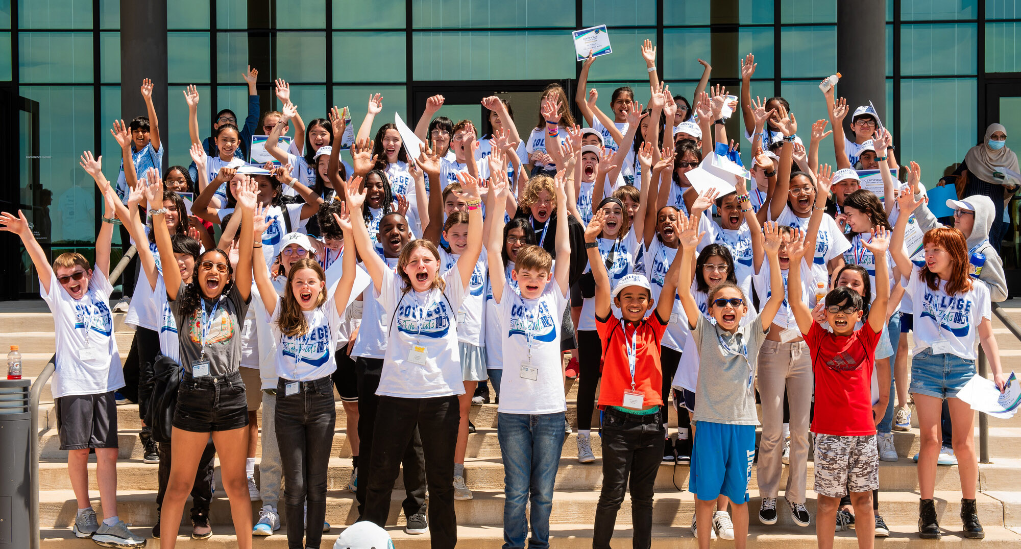 Members of the Wylie Campus College for Kids celebrate their graduation. 金沙博彩于2024年举办了第一届儿童学院夏令营。 The youth enrichment program was offered at the Wylie and Plano campuses.