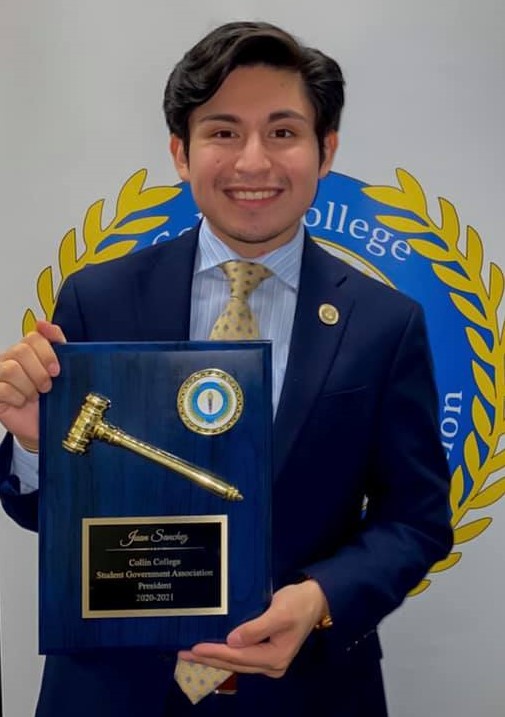 SGA president with plaque