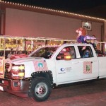 Colin Cougar waves from a truck during the parade. Diana-waving-0100-sm