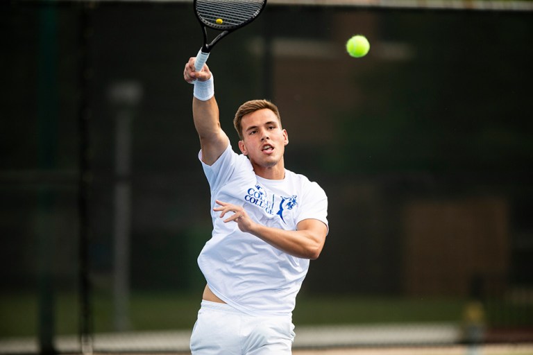 Collin College sophomore tennis player Rafal Bednarczuk mid-swing on the tennis court.