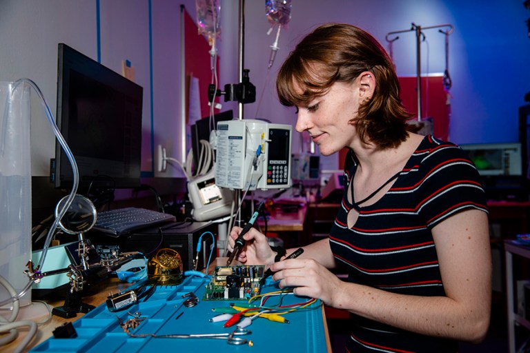 Sarah Merrill, Collin College Biomedical Equipment Tech student, working on medical equipment.