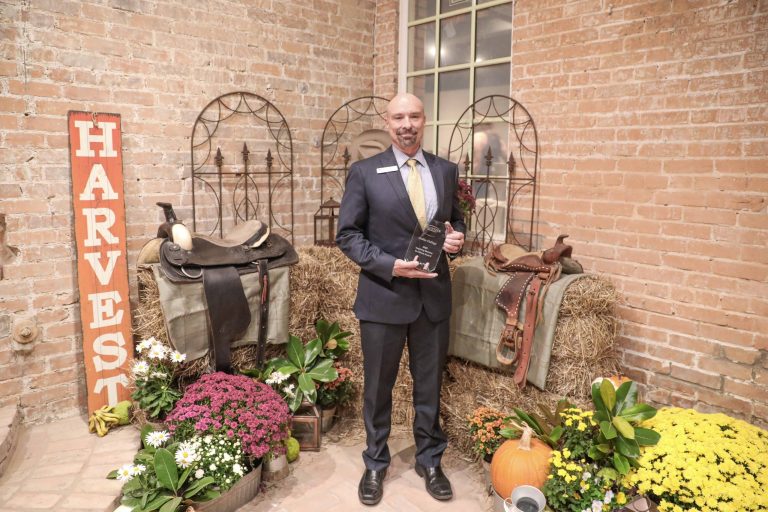 Dr. Mark Smith, provost of McKinney Campus, accepting the Inspiring Service to Others Award at the Spirit of McKinney awards ceremony. Photo by Bruce Quernrmoen