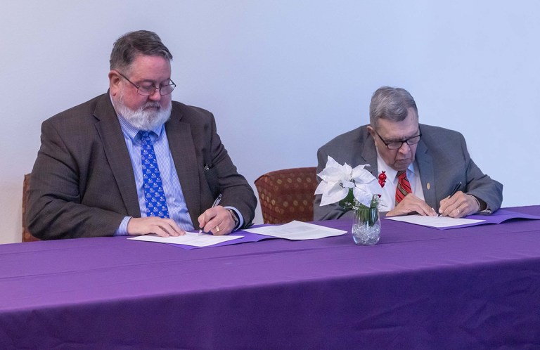 Pictured from left: Collin College District President Dr. Neil Matkin and Ranger College President Derrick Worrels sign the partnership agreement for the Texas Higher Education Coordinating Board TRUE grant.